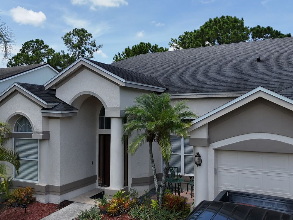 Completed architectural shingle roof on a Central Florida home installed by AlphaCore Roofing