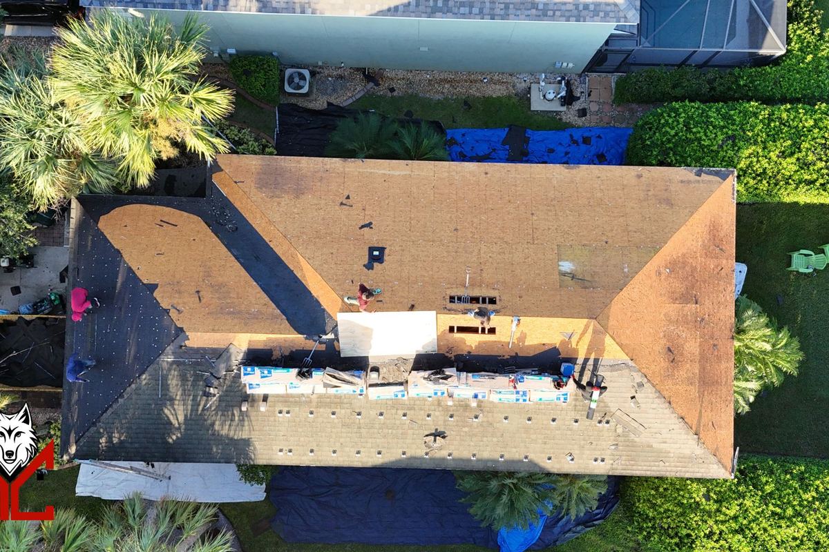 Aerial view of an Orlando roof during replacement with decking and underlayment exposed